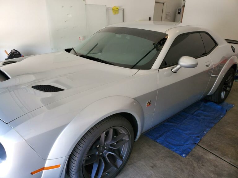 A Silver Dodge Challenger Parked in the Garage