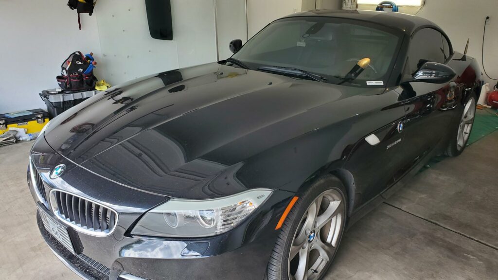 A Black BMW Z4 Parked in a Garage