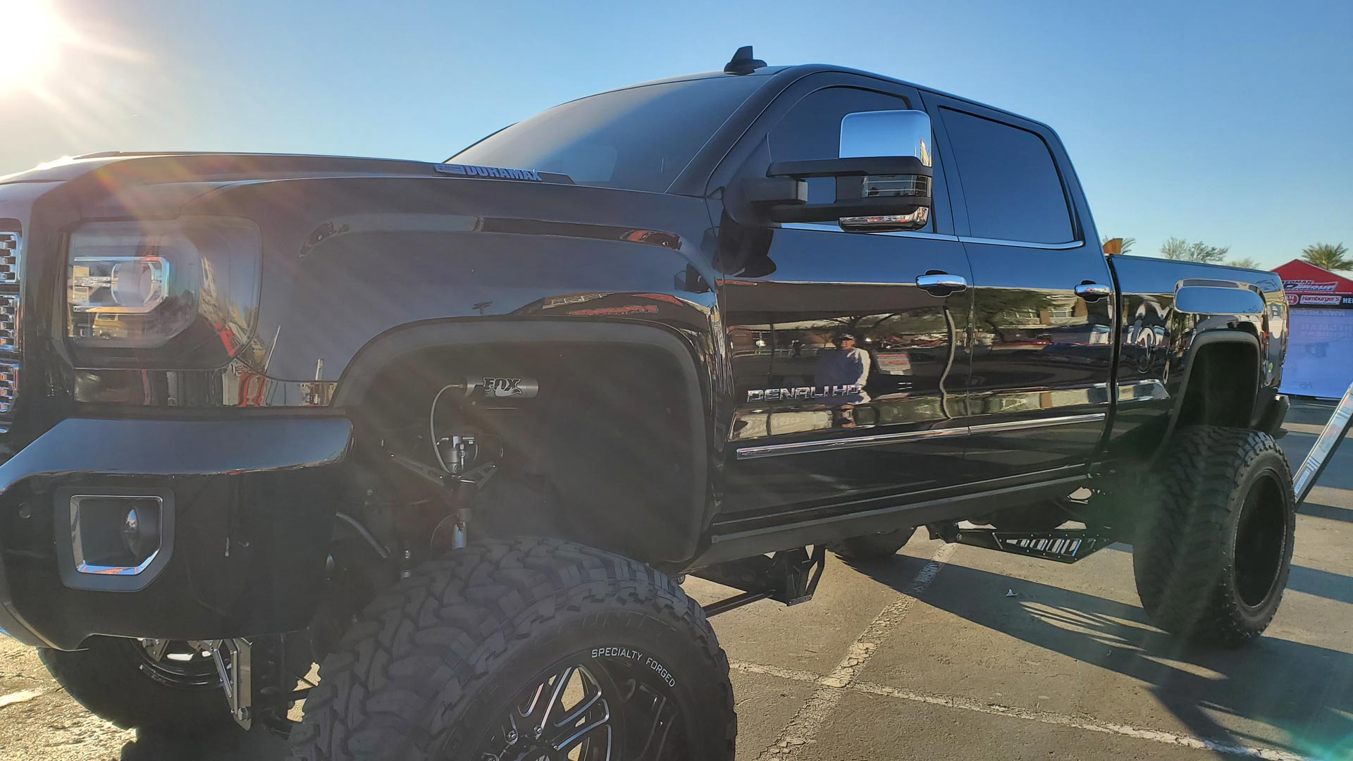 Dark Truck With Large Tire Attached